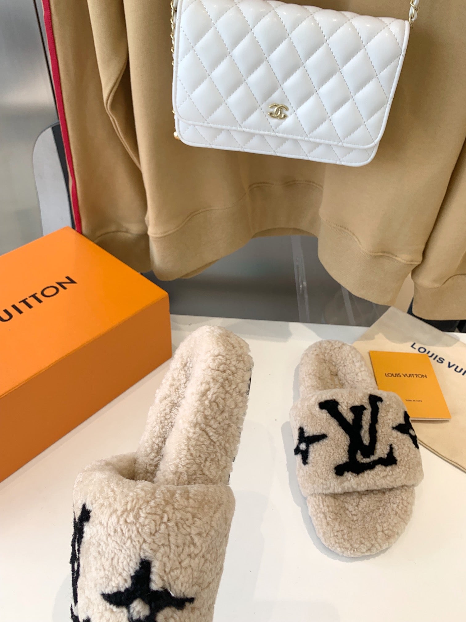 LOUIS VUITTON LV WOMEN'S PASEO FLAT SLIPPER IN TAN BROWN FLEECE WITH BLACK LOGO