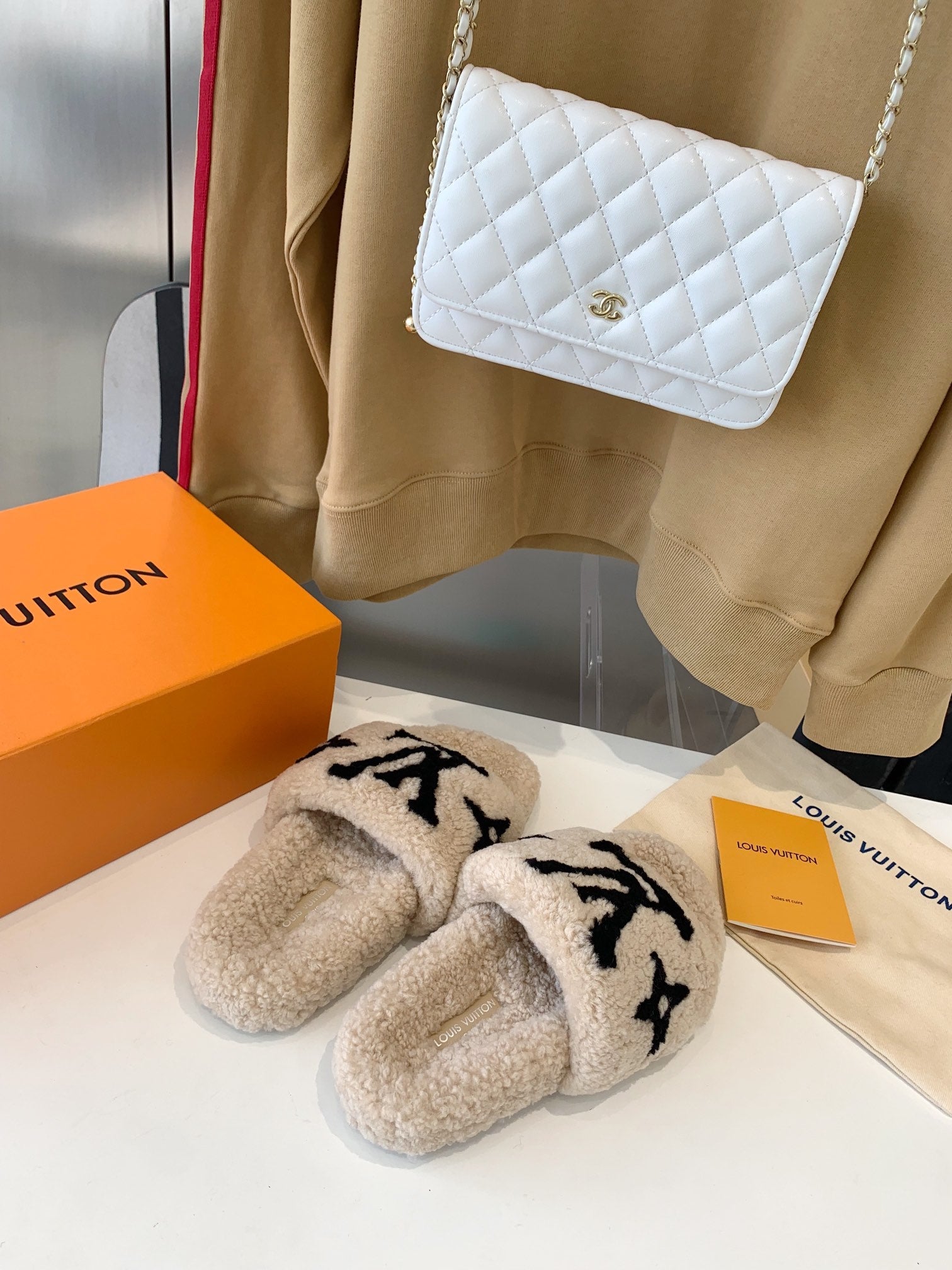 LOUIS VUITTON LV WOMEN'S PASEO FLAT SLIPPER IN TAN BROWN FLEECE WITH BLACK LOGO