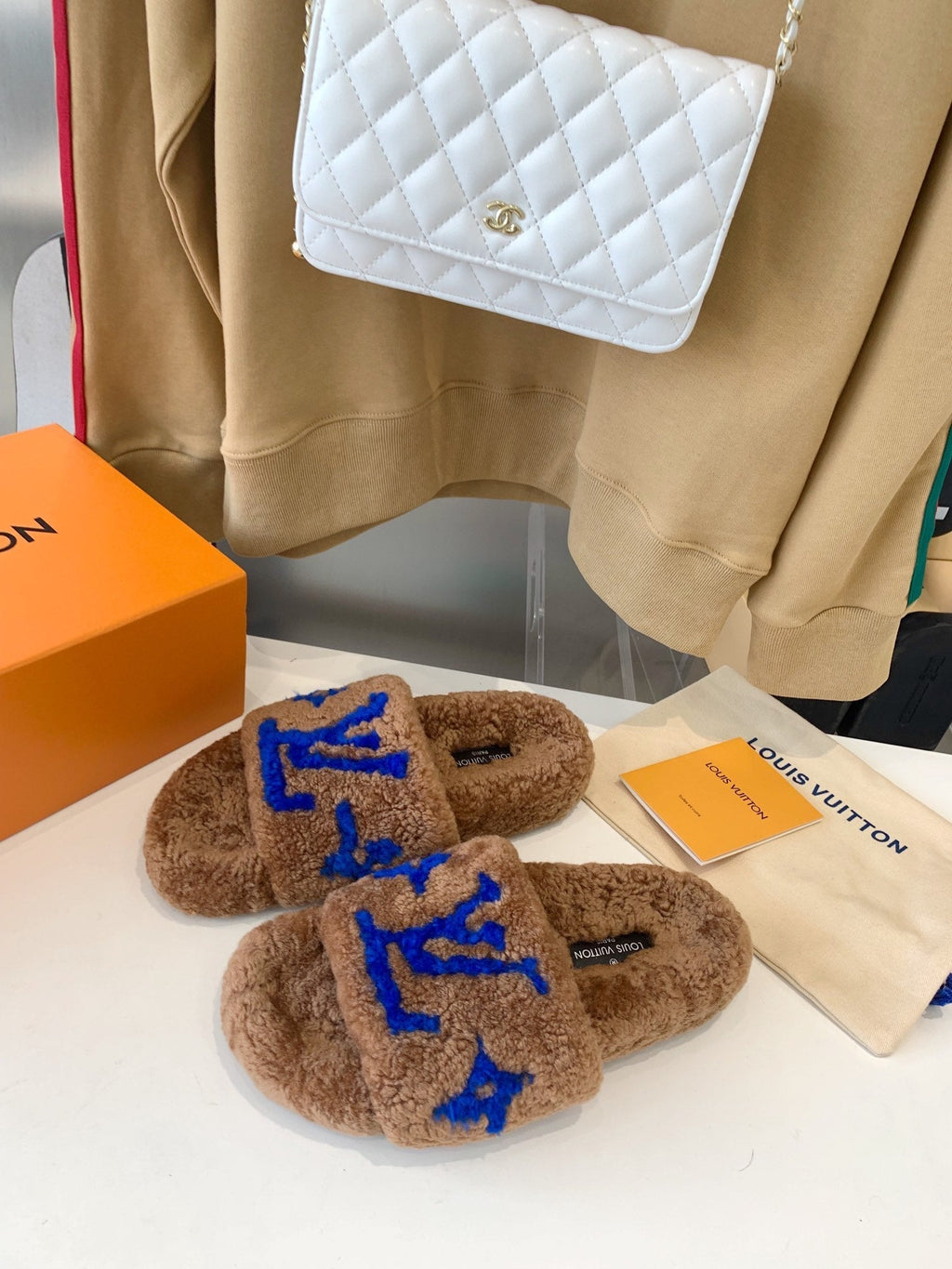LOUIS VUITTON LV WOMEN'S PASEO FLAT SLIPPER IN BROWN FLEECE WITH BLUE LOGO