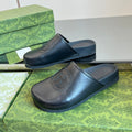 GUCCI INTERLOCKING G MULE IN BLACK CALFSKIN