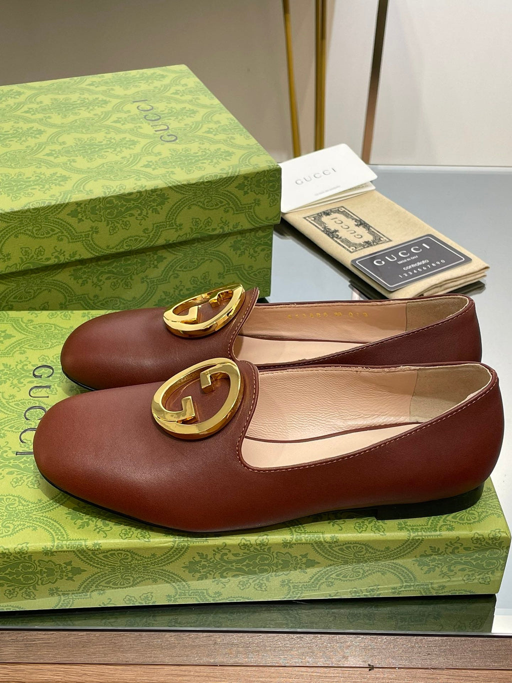 GUCCI BLONDIE LOGO-PLAQUE LOAFERS IN SYRUP BROWN CALFSKIN WITH GOLD HARDWARE