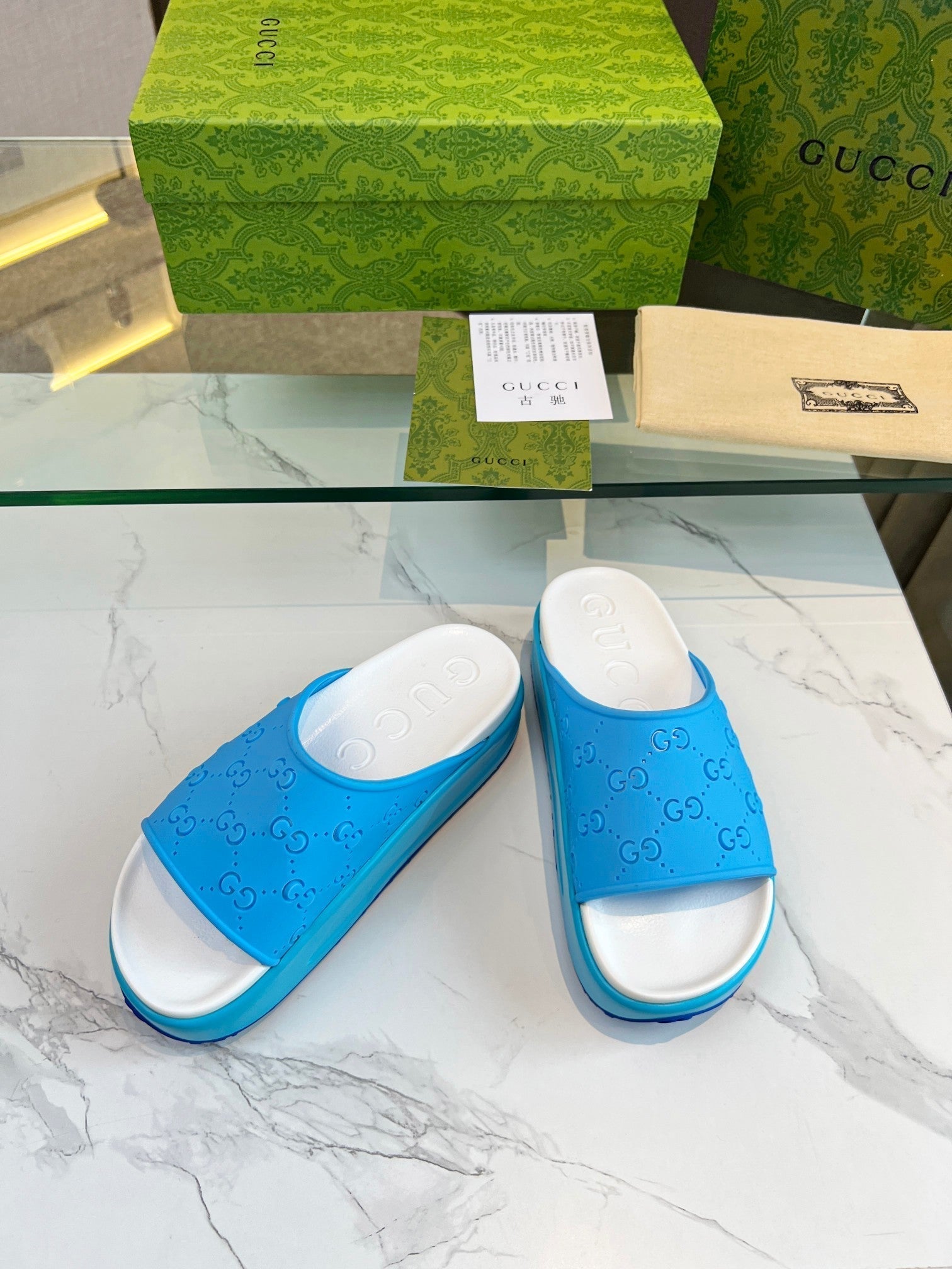 GUCCI PLATFORM SANDALS IN SKY BLUE MONOGRAM IMPORTED TPU