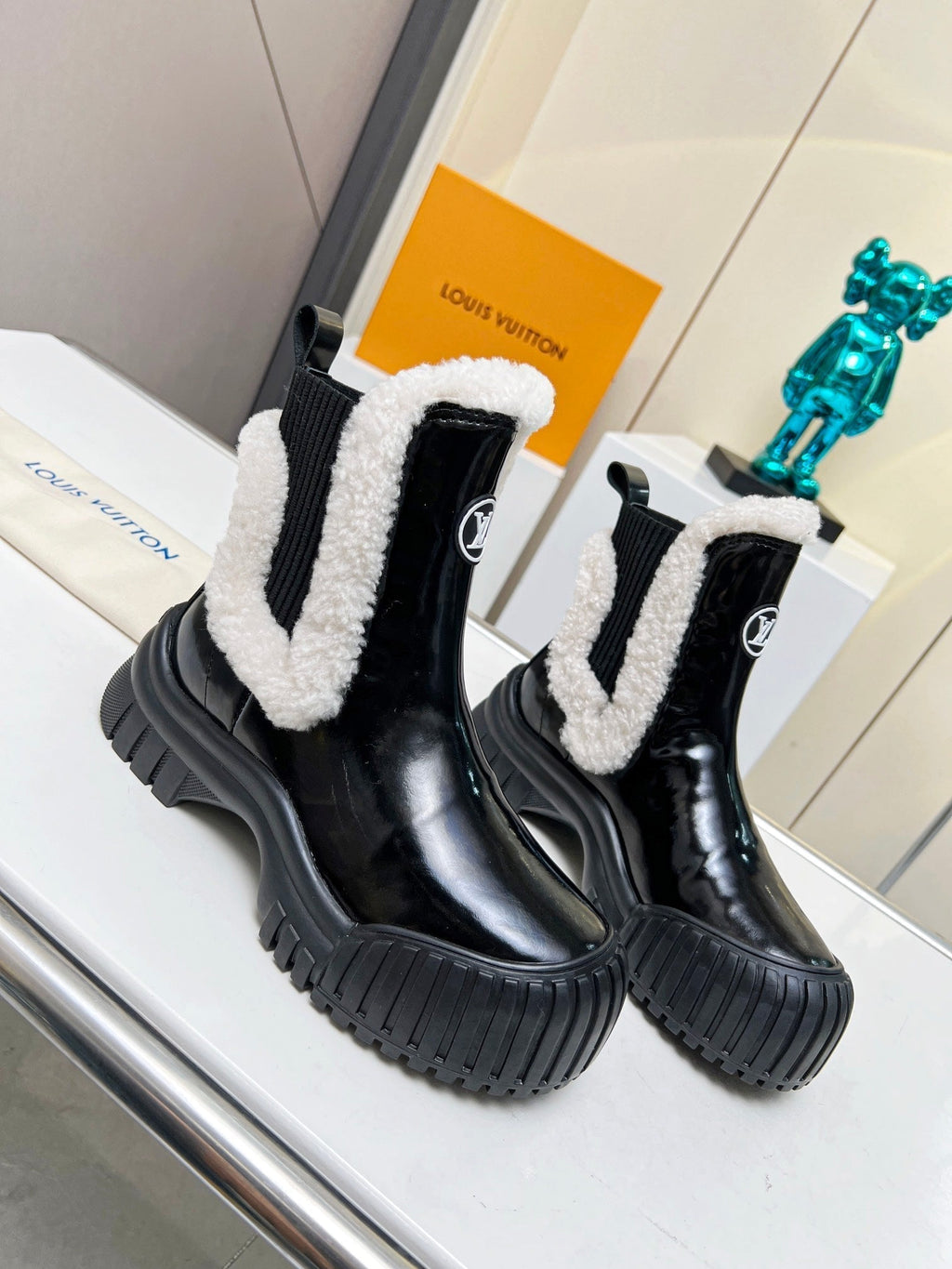 LOUIS VUITTON LV RUBY FLAT ANKLE BOOT IN BLACK CALFSKIN AND WHITE SHEARLING