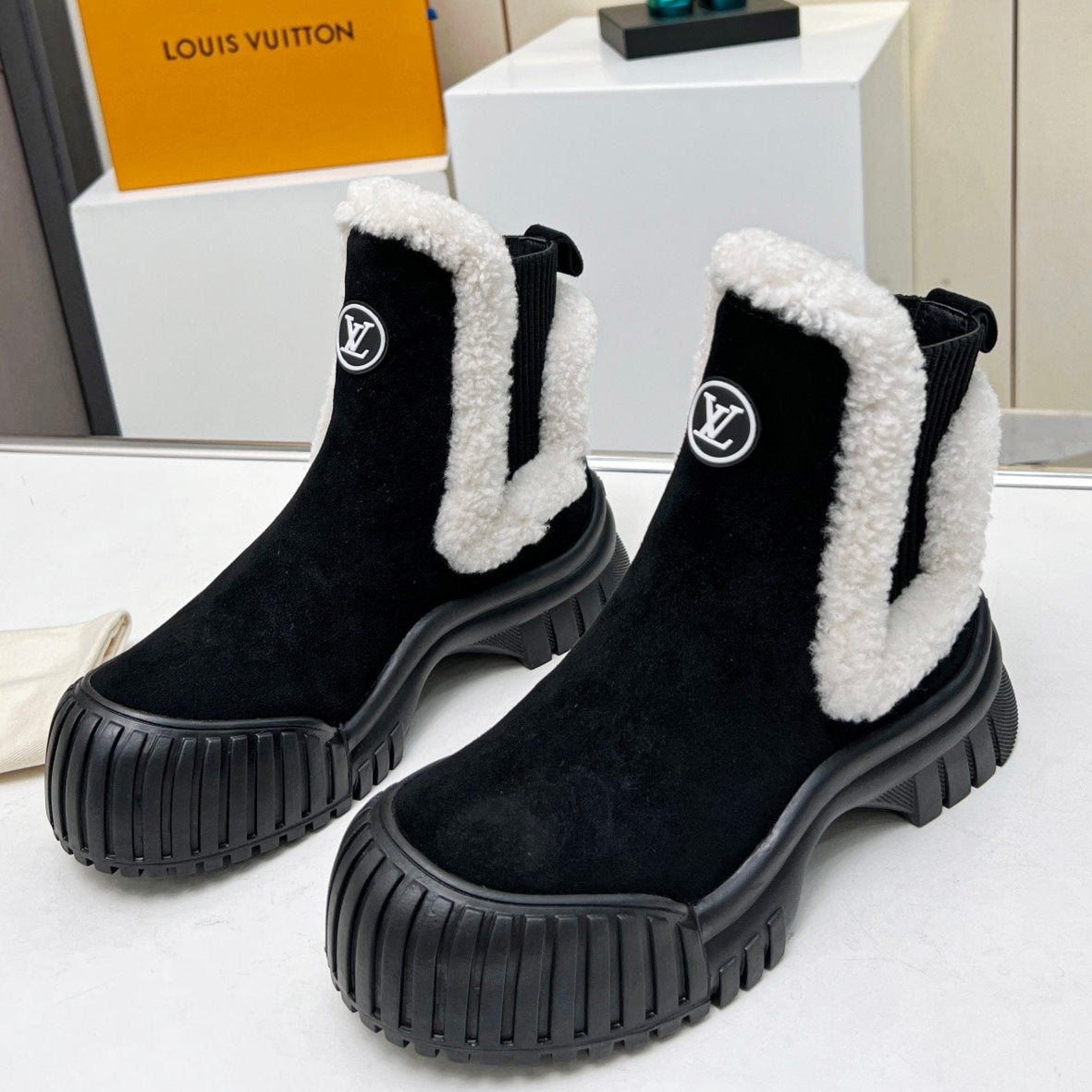 LOUIS VUITTON LV RUBY FLAT ANKLE BOOT IN BLACK SUEDE CALF LEATHER AND WHITE SHEARLING