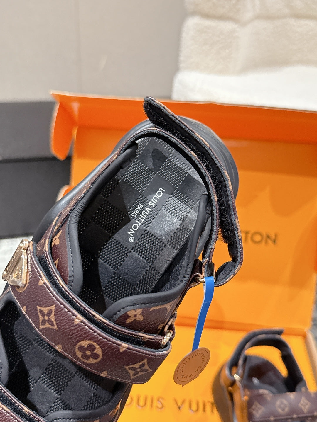 LOUIS VUITTON LV WEDGE SANDALS 25S 55 MM IN BROWN AND BLACK CALFSKIN WITH LOGO PATTERN