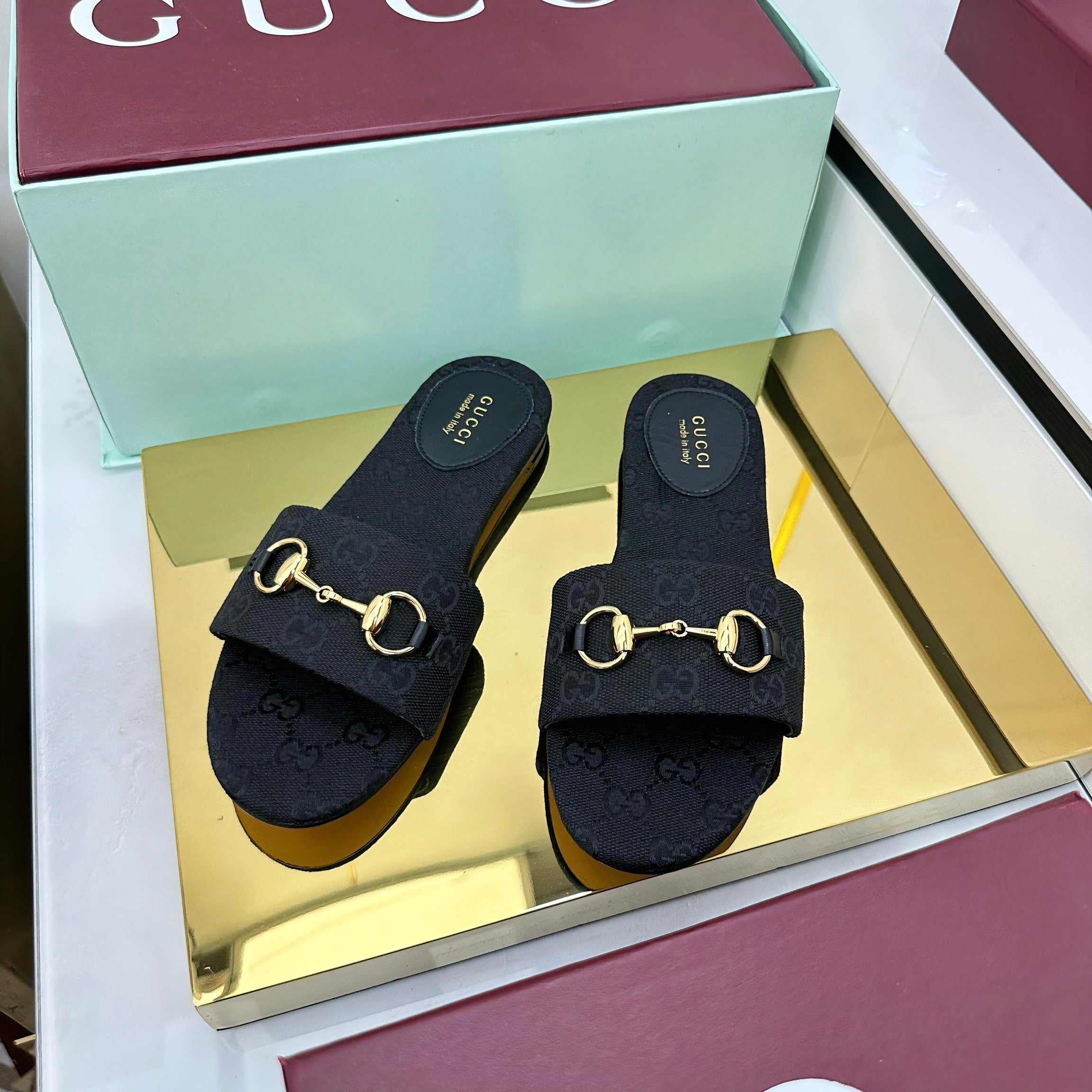 GUCCI SLIDES IN BLACK WITH GOLD HARDWARE