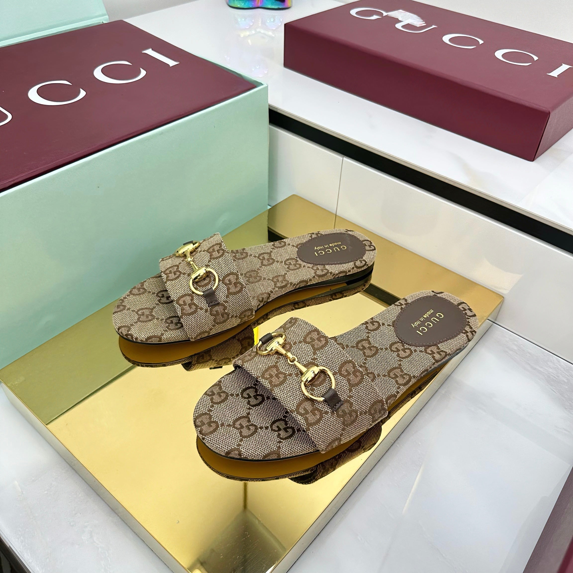 GUCCI SLIDES IN DARK BEIGE WITH GOLD HARDWARE