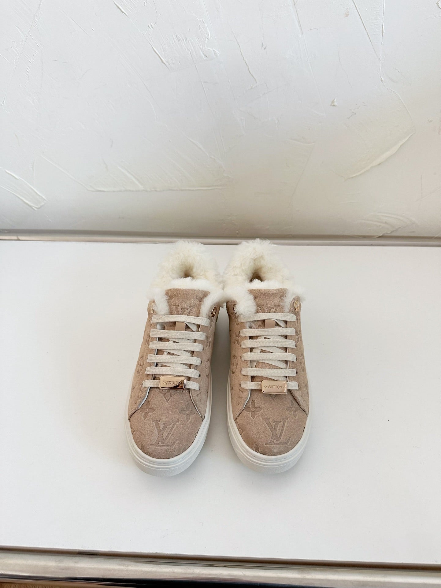 LOUIS VUITTON TIME OUT SNEAKER IN DESERT BROWN MONOGRAM EMBOSSED SUEDE WITH FLEECE LINING