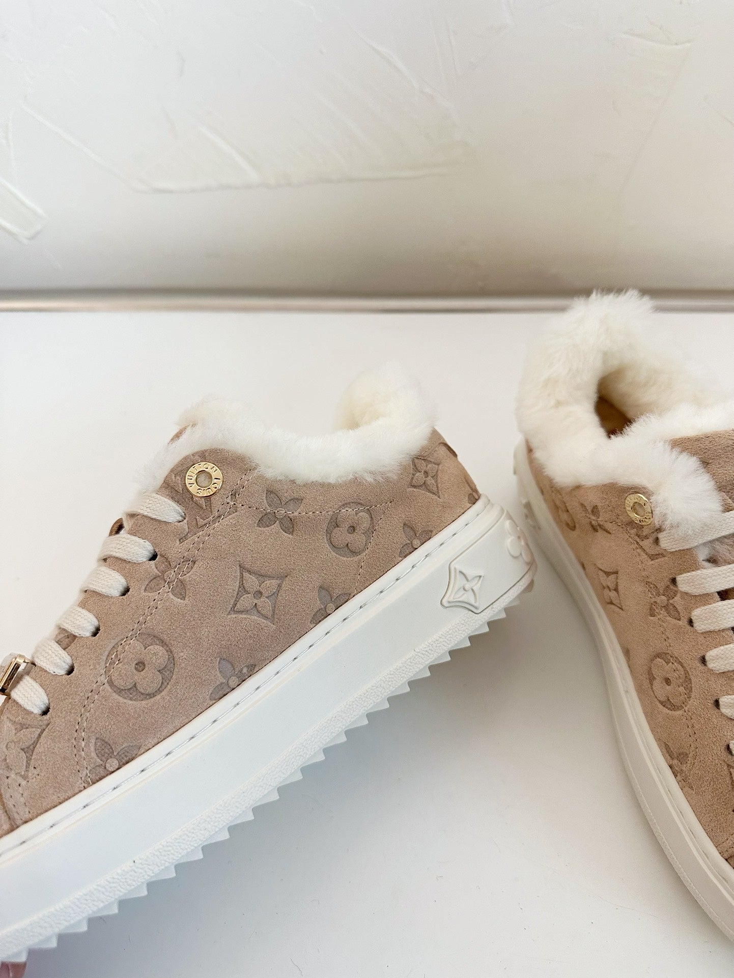 LOUIS VUITTON TIME OUT SNEAKER IN DESERT BROWN MONOGRAM EMBOSSED SUEDE WITH FLEECE LINING