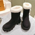 LOUIS VUITTON ANKLE BOOTS IN BLACK EMBOSSED CALFSKIN AND WHITE SHEARLING
