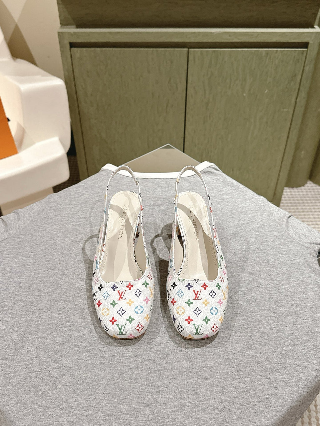 LOUIS VUITTON SWING SLINGBACK PUMP 55 MM IN WHITE MONOGRAM CALFSKIN