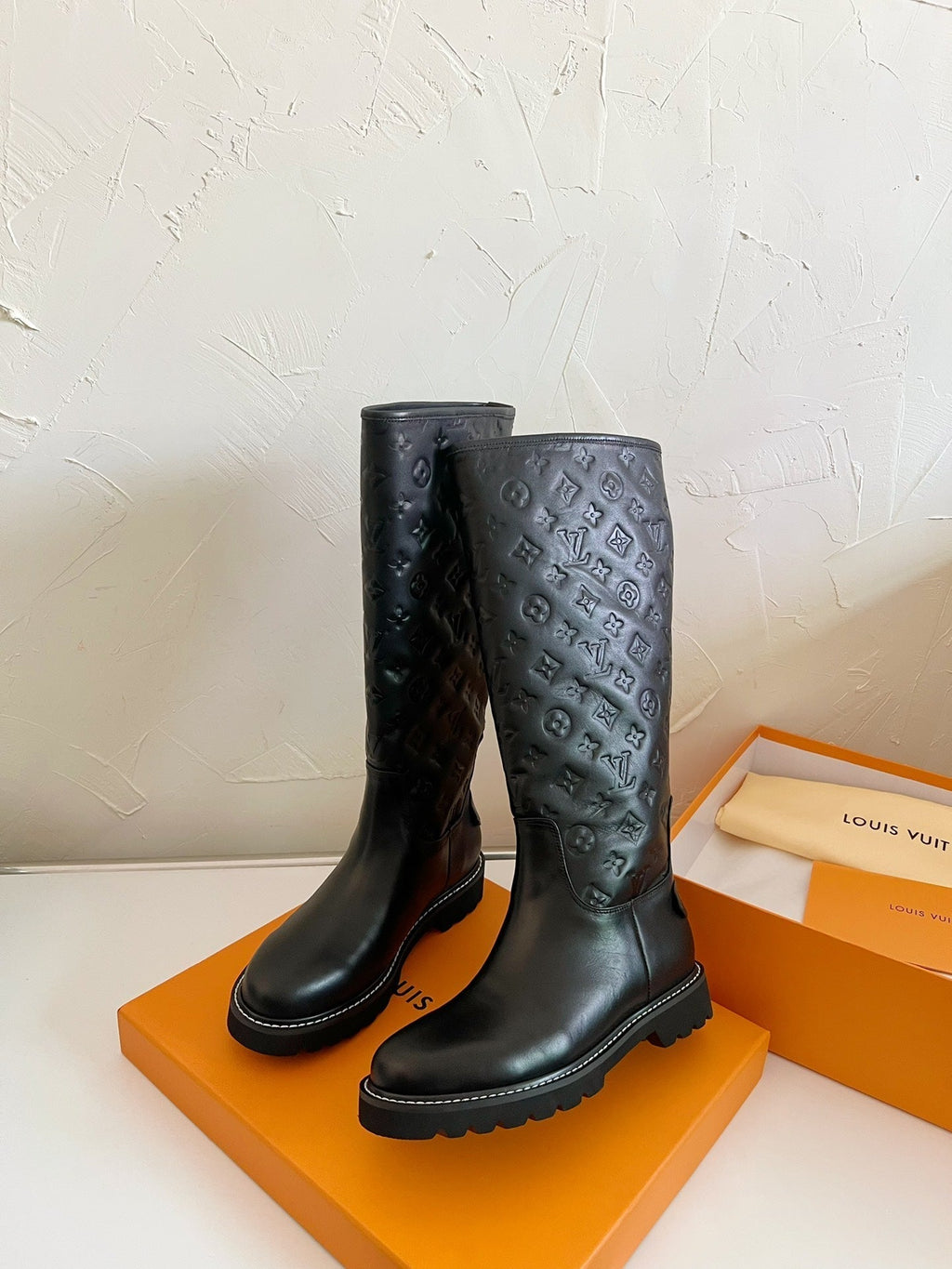 LOUIS VUITTON TERRITORY FLAT HIGH BOOT IN BLACK EMBOSSED CALFSKIN