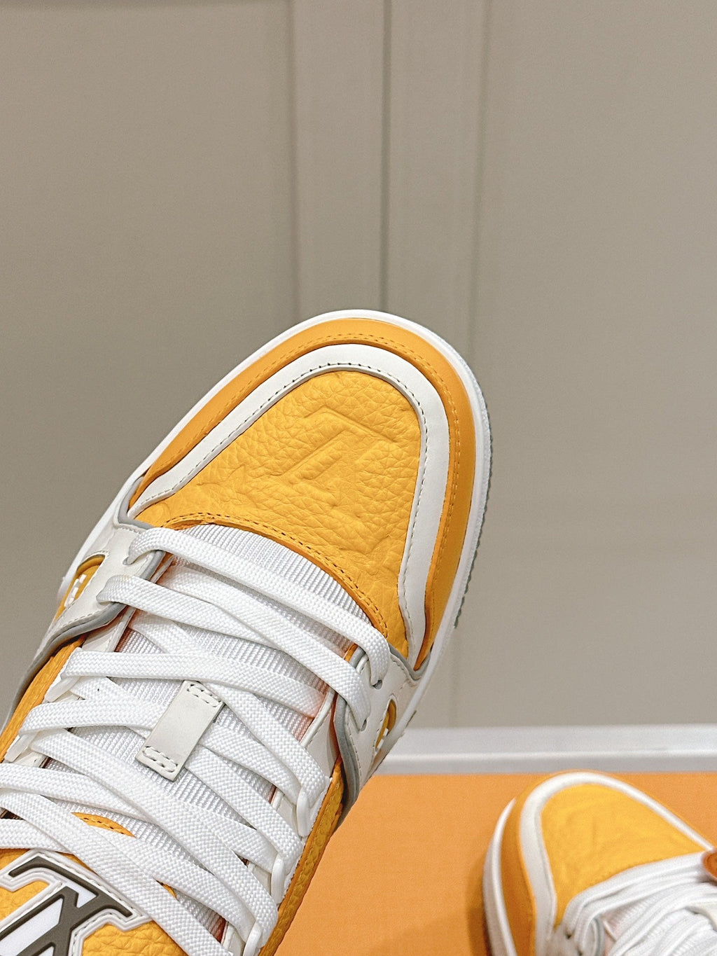 LOUIS VUITTON LV TRAINER SNEAKER IN SAFFRAN YELLOW GRAINED CALFSKIN