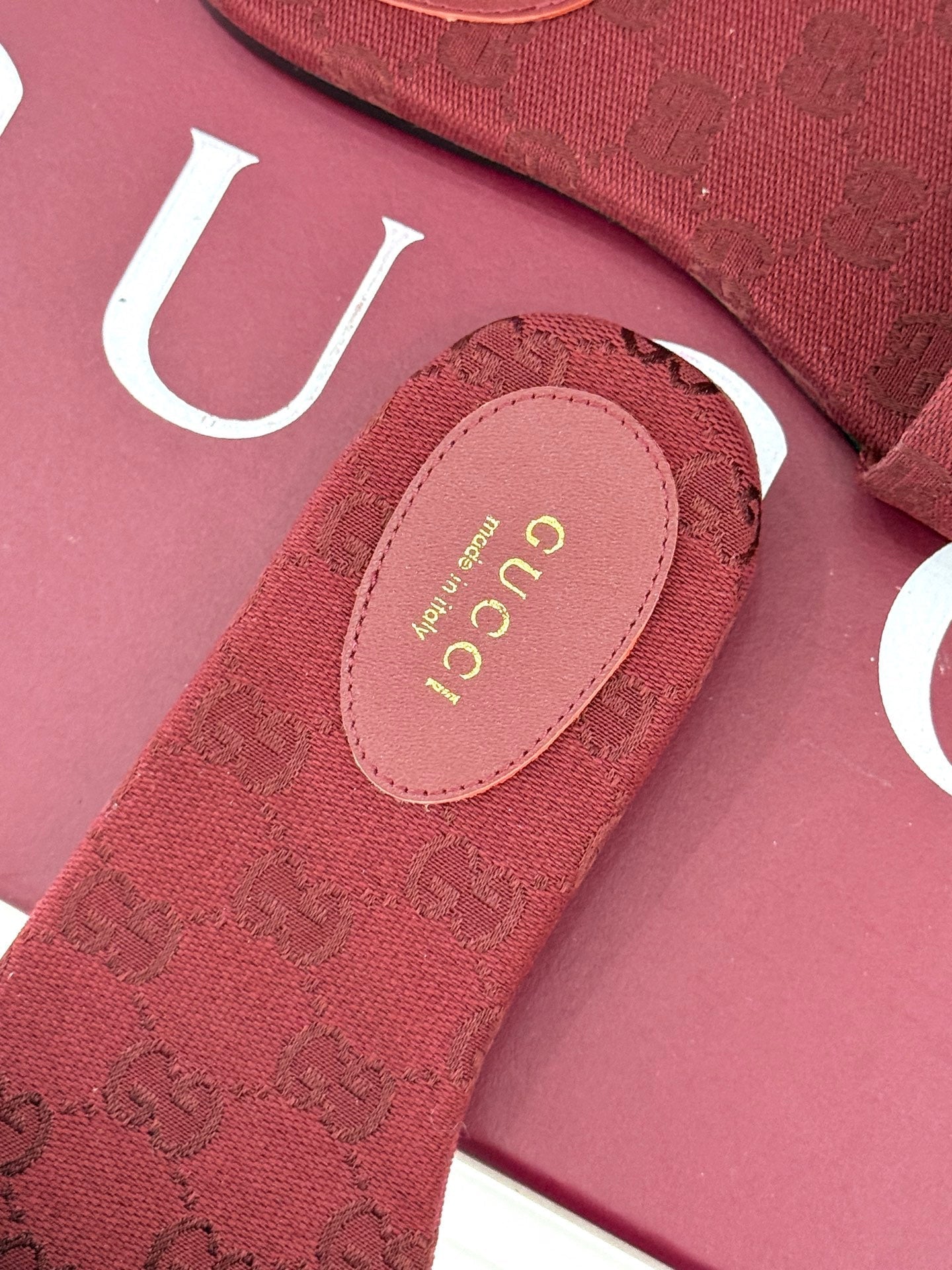 GUCCI SLIDE SANDALS IN RED FABRIC EMBOSSED LOGO