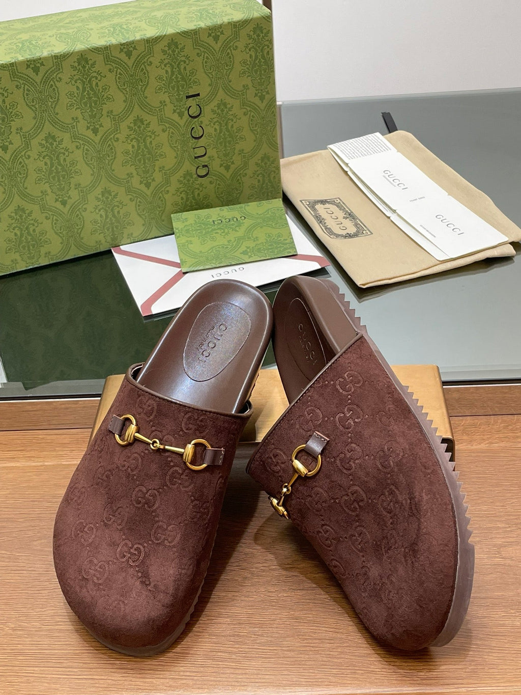 GUCCI HORSEBIT MULE IN CHOCOLATE BROWN EMBOSSED SUEDE AND SHEEPSKIN LINING