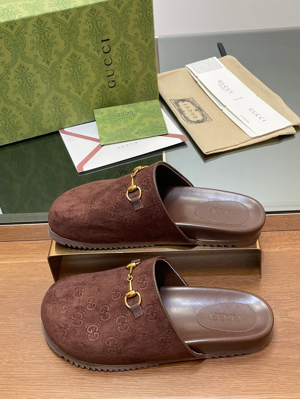 GUCCI HORSEBIT MULE IN CHOCOLATE BROWN EMBOSSED SUEDE AND SHEEPSKIN LINING