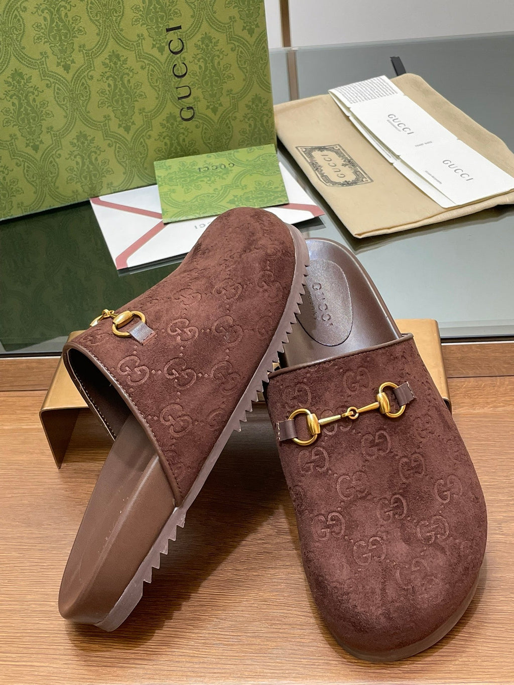 GUCCI HORSEBIT MULE IN CHOCOLATE BROWN EMBOSSED SUEDE AND SHEEPSKIN LINING