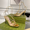 GUCCI STRAPPY SANDAL WITH RHINESTONE CHAIN IN GOLD PATENT LEATHER