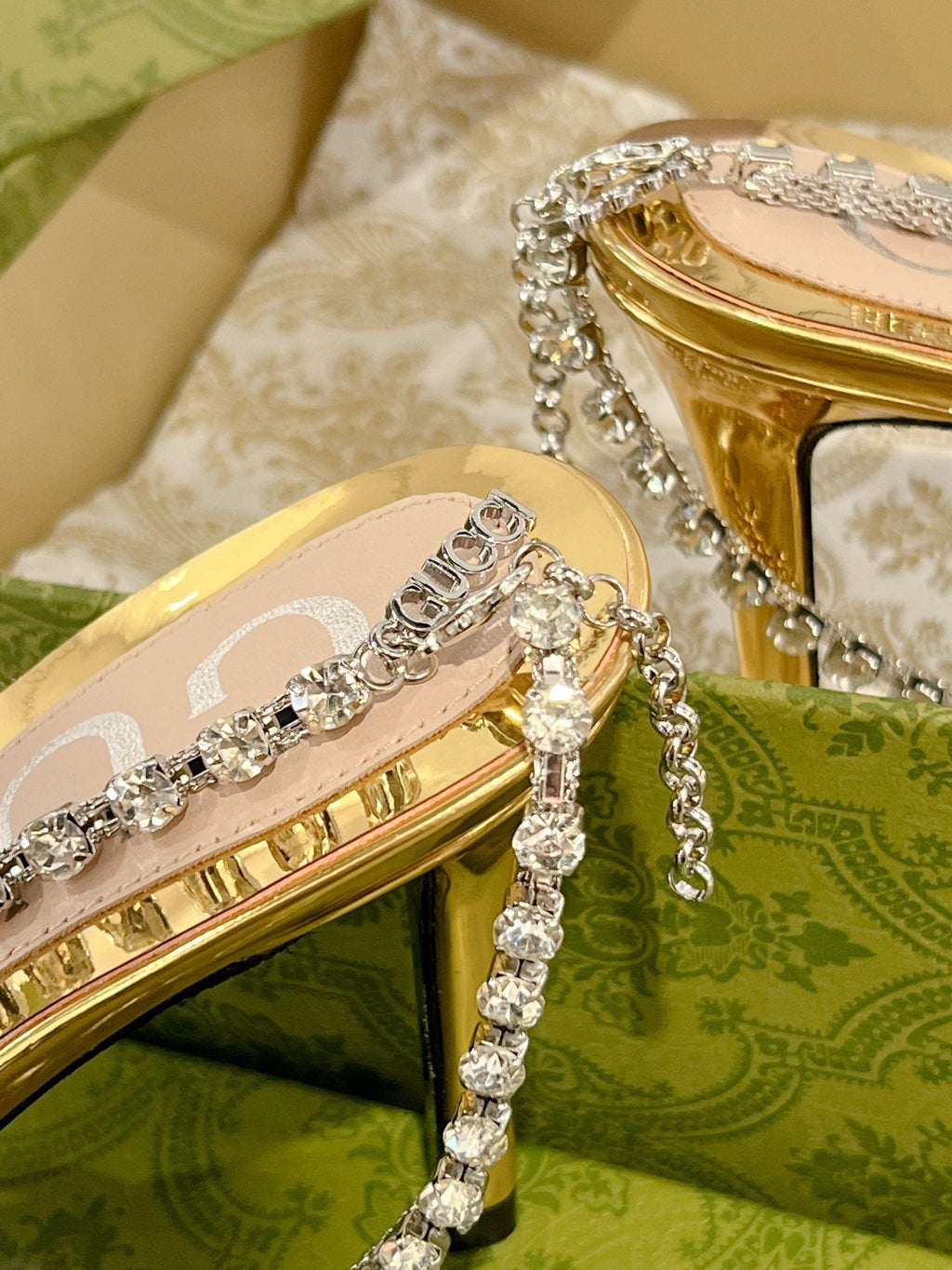 GUCCI STRAPPY SANDAL WITH RHINESTONE CHAIN IN GOLD PATENT LEATHER