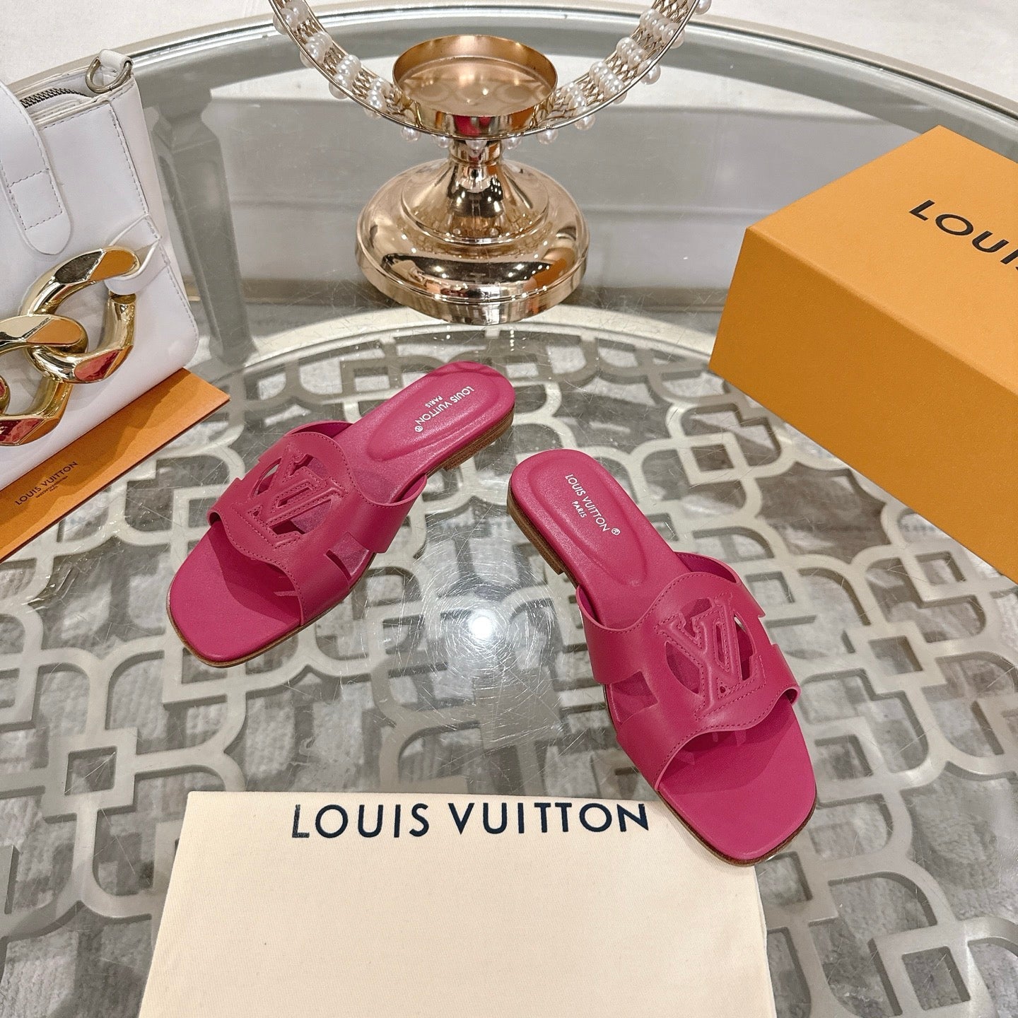 LOUIS VUITTON ISOLA FLAT SLIDE IN DARK PINK CALFSKIN