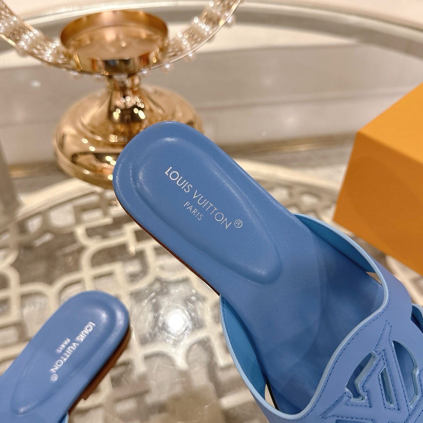 LOUIS VUITTON ISOLA FLAT SLIDE IN CORNFLOWER BLUE CALFSKIN