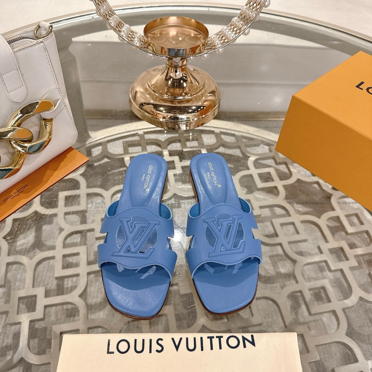 LOUIS VUITTON ISOLA FLAT SLIDE IN CORNFLOWER BLUE CALFSKIN