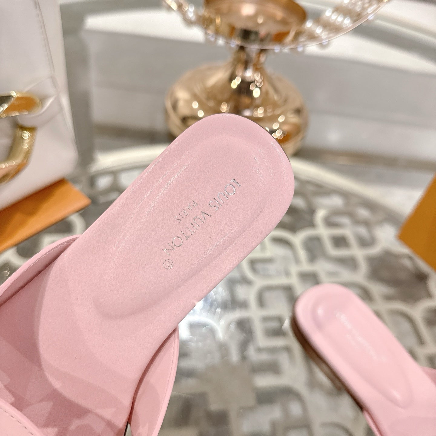 LOUIS VUITTON ISOLA FLAT SLIDE IN PASTEL PINK CALFSKIN