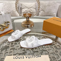 LOUIS VUITTON ISOLA FLAT SLIDE IN WHITE CALFSKIN
