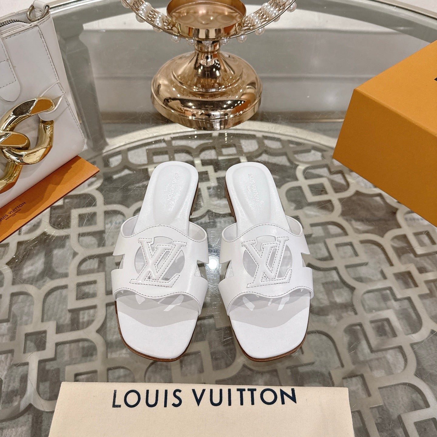 LOUIS VUITTON ISOLA FLAT SLIDE IN WHITE CALFSKIN