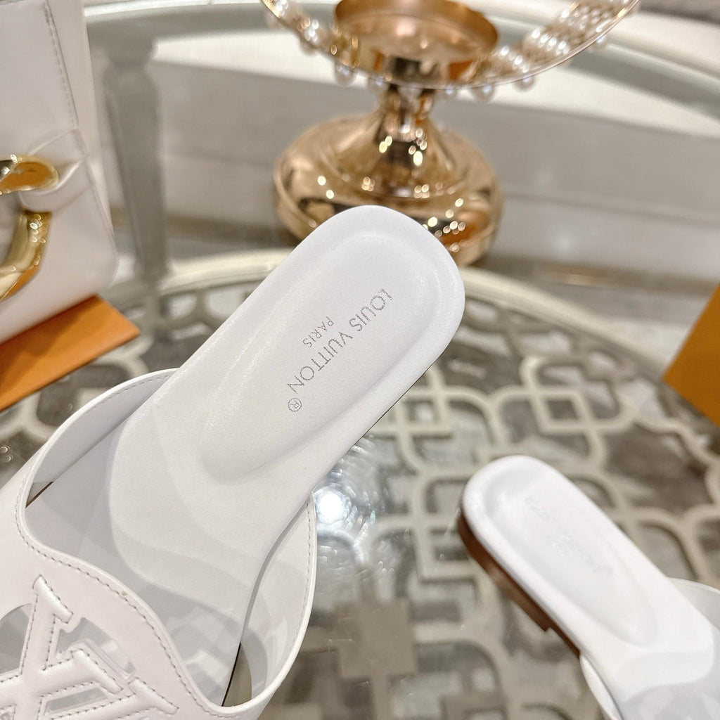 LOUIS VUITTON ISOLA FLAT SLIDE IN WHITE CALFSKIN