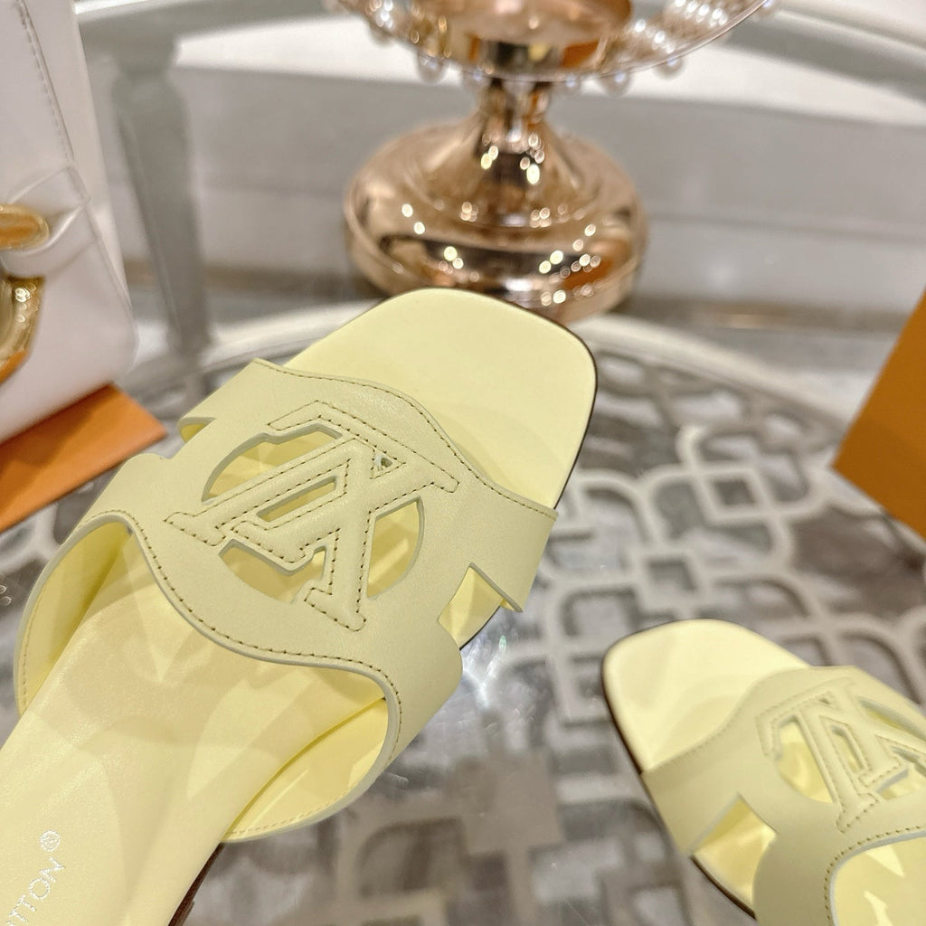 LOUIS VUITTON ISOLA FLAT SLIDE IN PALE YELLOW CALFSKIN