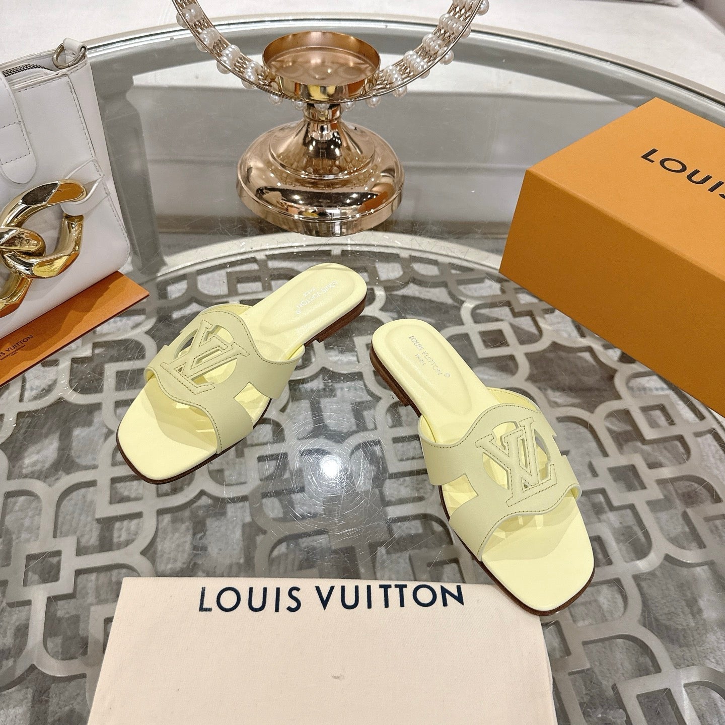LOUIS VUITTON ISOLA FLAT SLIDE IN PALE YELLOW CALFSKIN