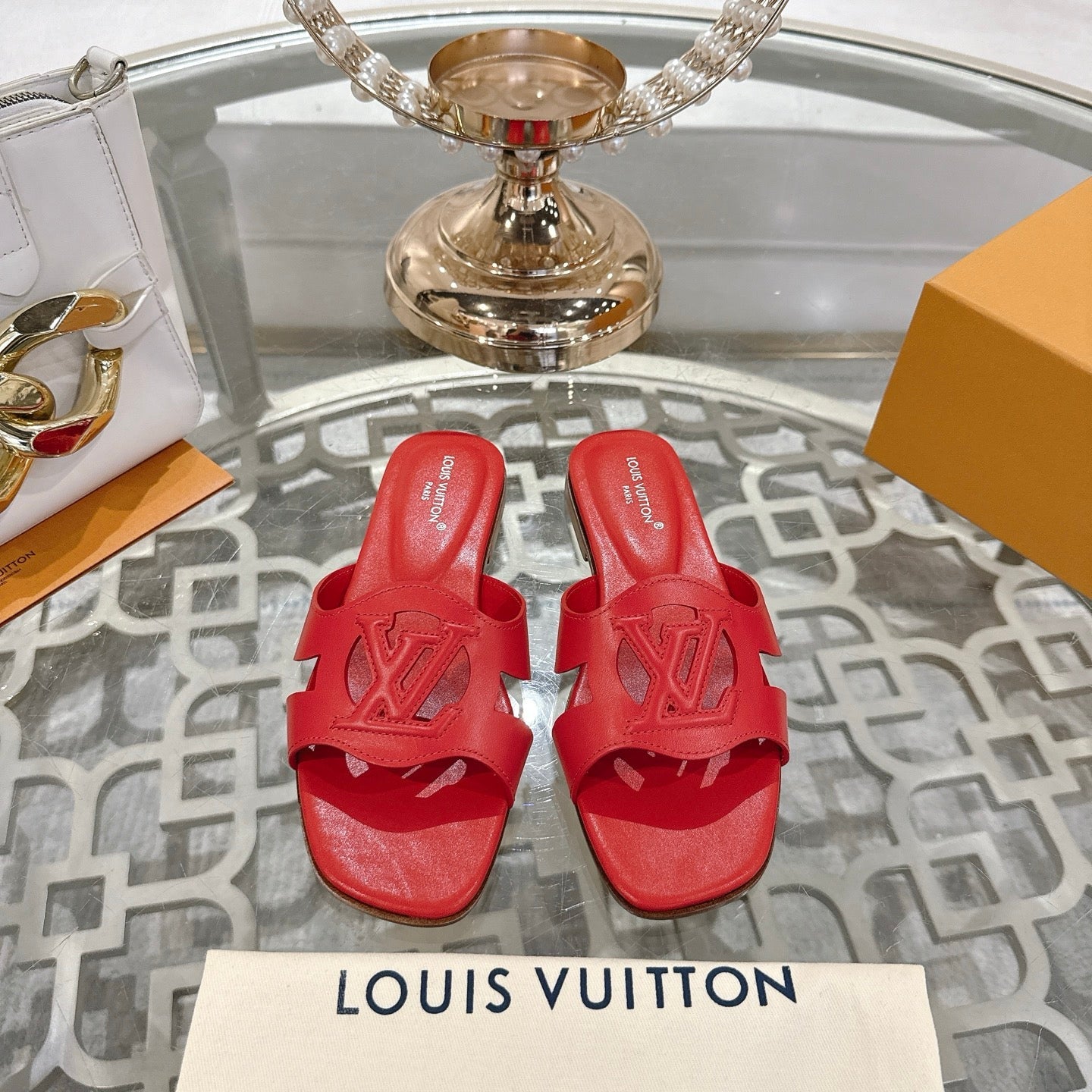 LOUIS VUITTON ISOLA FLAT SLIDE IN CHERRY RED CALFSKIN