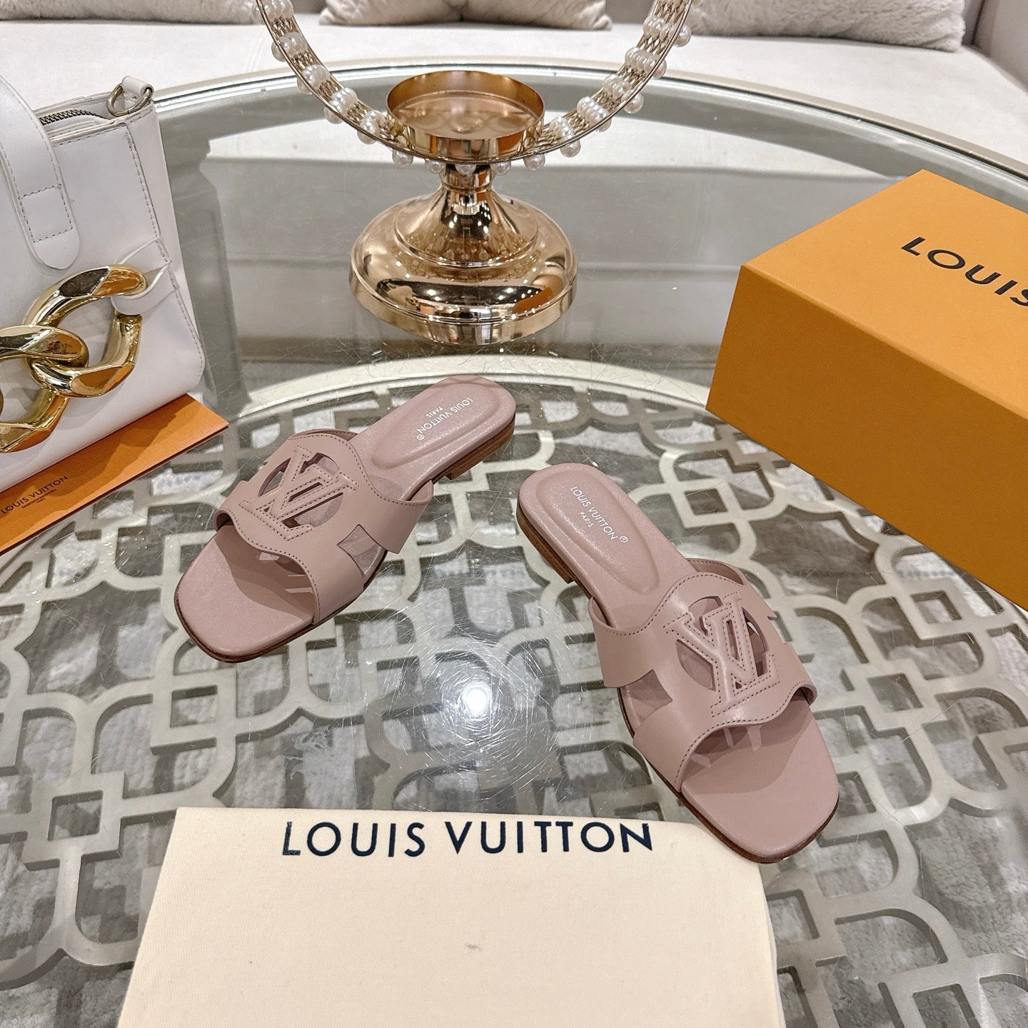 LOUIS VUITTON ISOLA FLAT SLIDE IN DUSTY PINK CALFSKIN