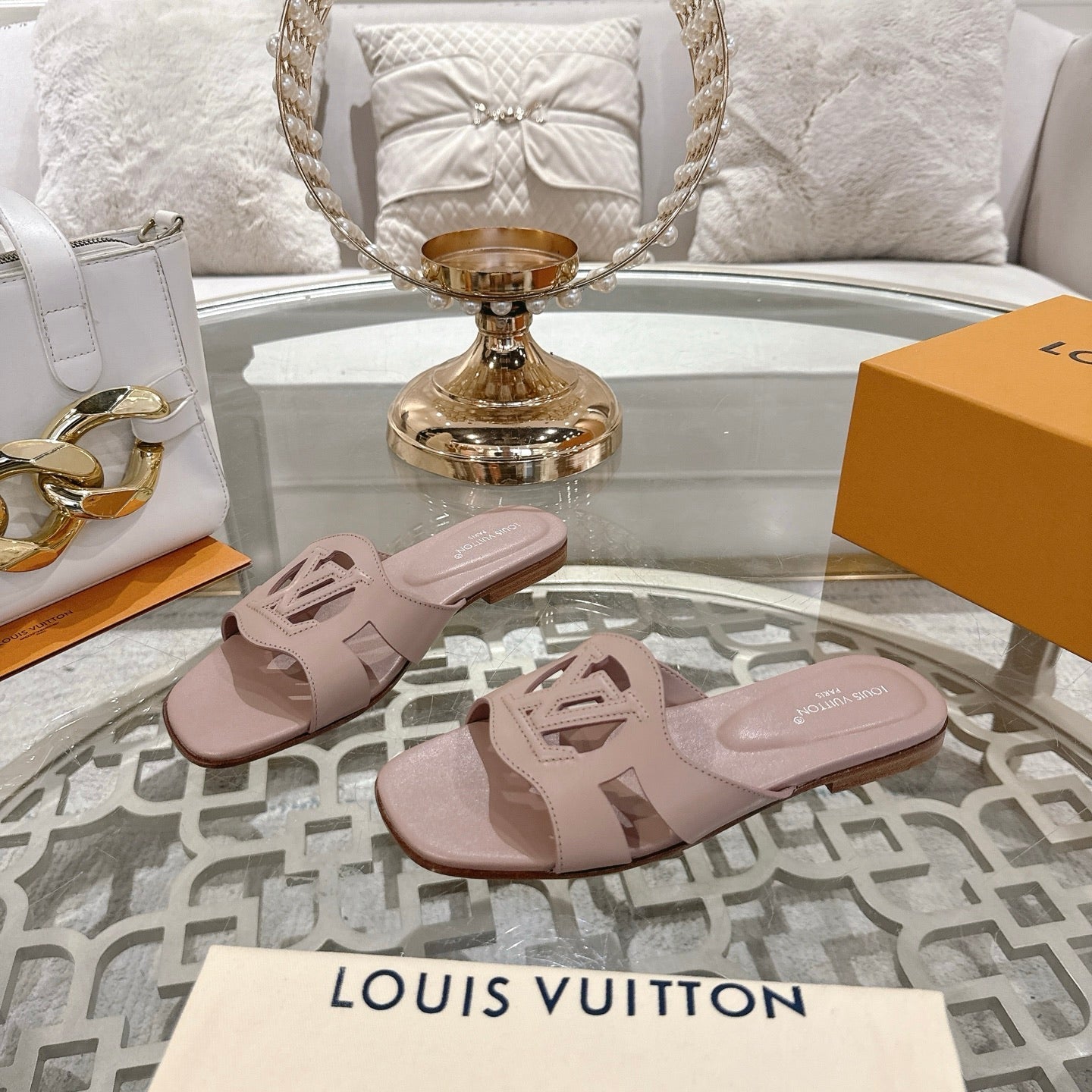 LOUIS VUITTON ISOLA FLAT SLIDE IN DUSTY PINK CALFSKIN