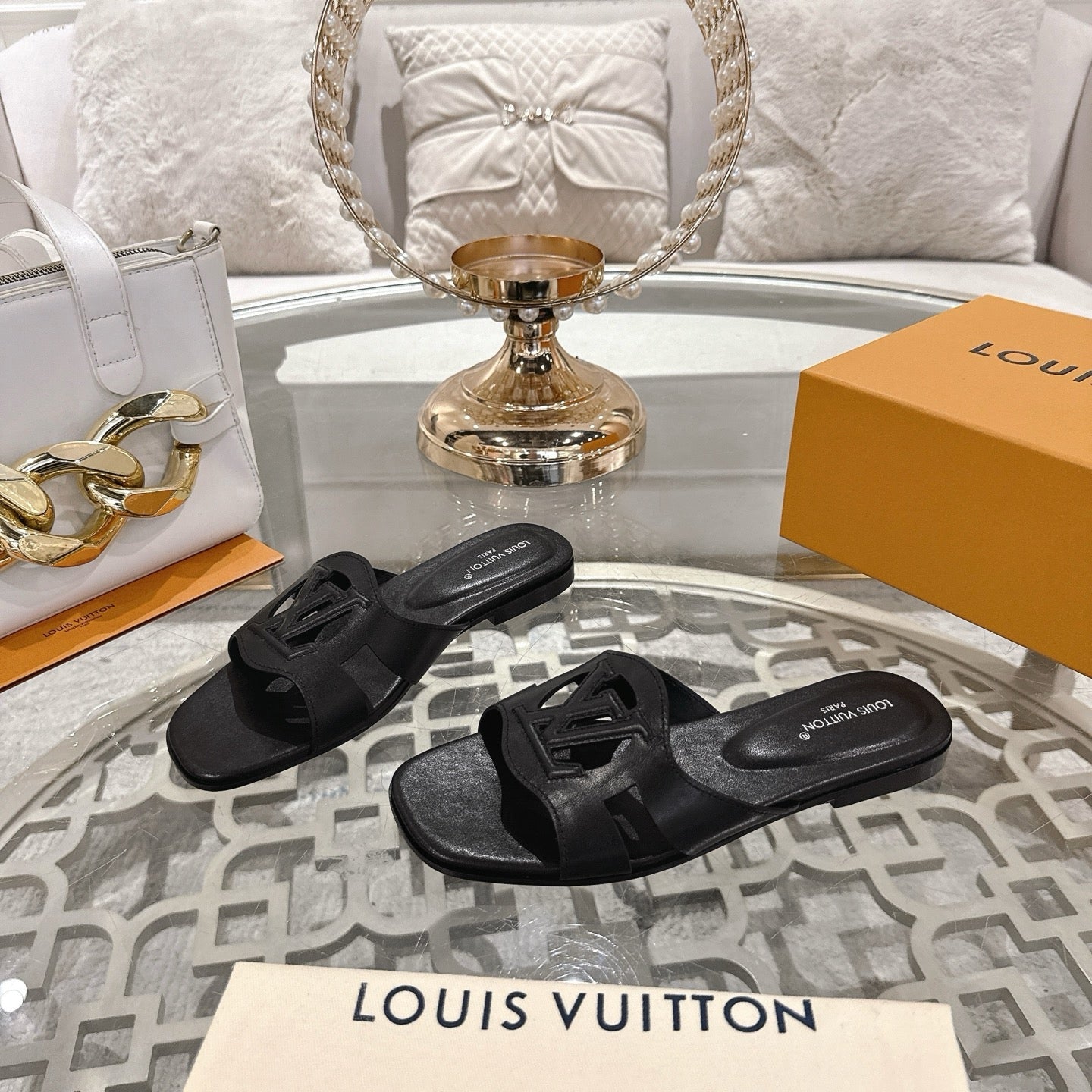 LOUIS VUITTON ISOLA FLAT SLIDE IN BLACK CALFSKIN