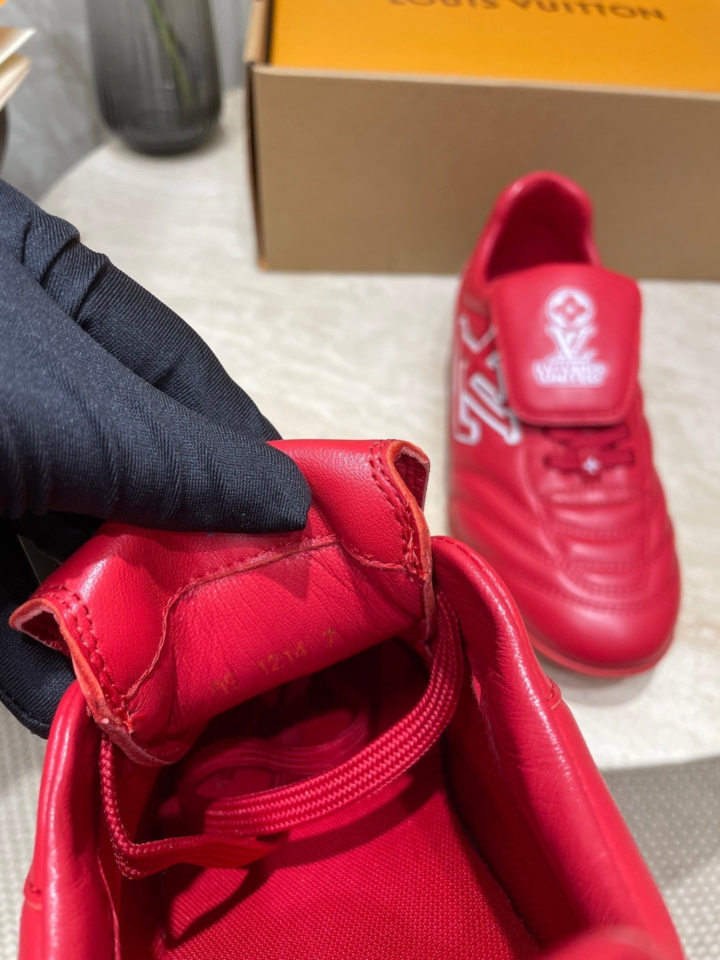 LOUIS VUITTON FOOTPRINT SOCCER SNEAKER IN CHERRY RED CALFSKIN