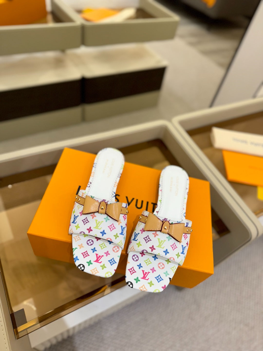 LOUIS VUITTON LV X TM 6AM FLAT MULE IN WHITE MONOGRAM CALFSKIN