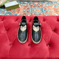 GUCCI CROSS STRAP FLAT SHOES IN BLACK CALFSKIN WITH STRAW SOLE