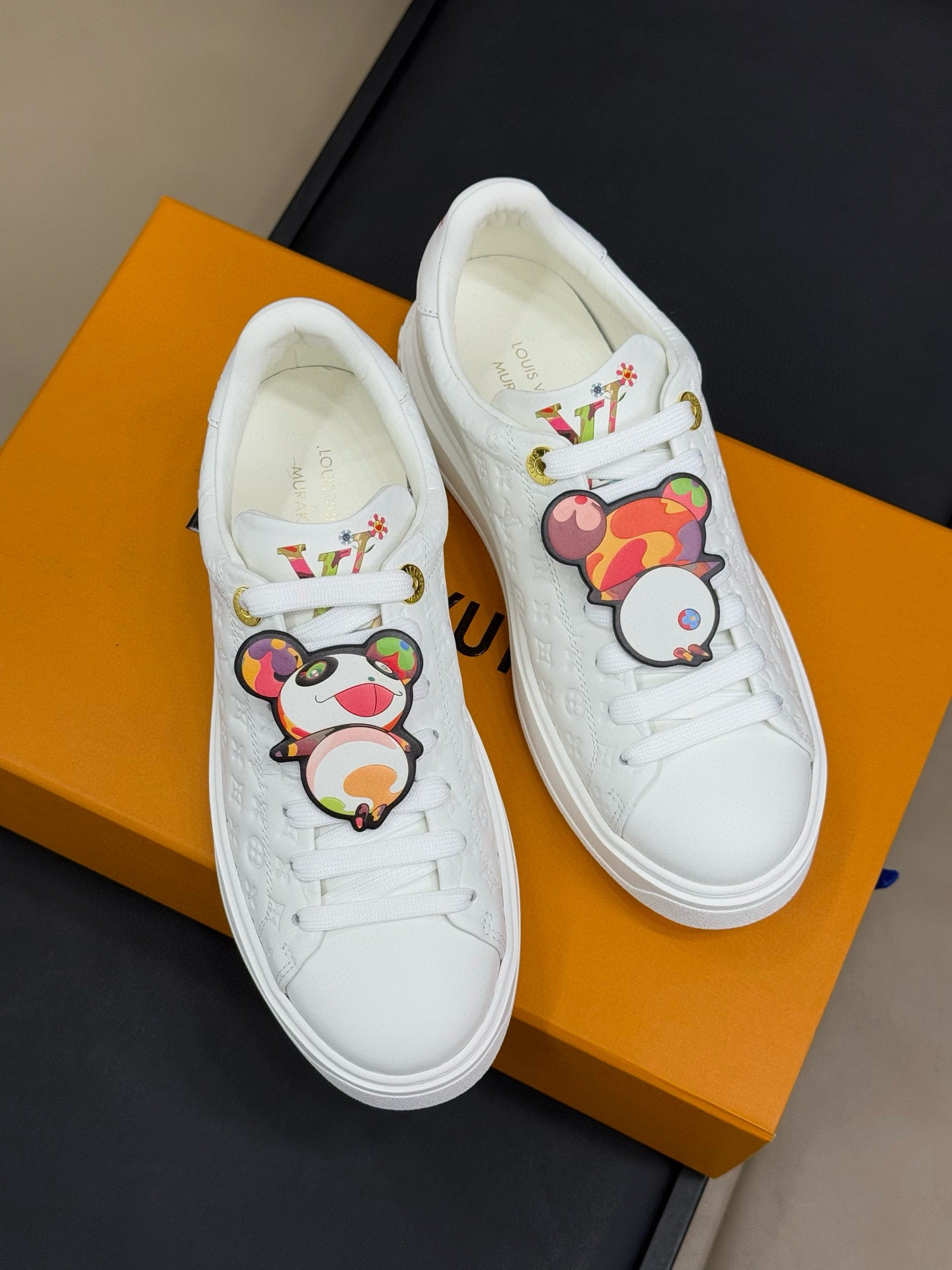 LOUIS VUITTON TIME OUT SNEAKER IN WHITE EMBOSSED MONOGRAM CALFSKIN