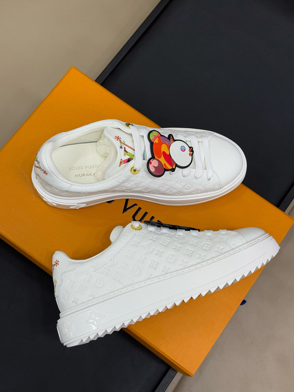 LOUIS VUITTON TIME OUT SNEAKER IN WHITE EMBOSSED MONOGRAM CALFSKIN