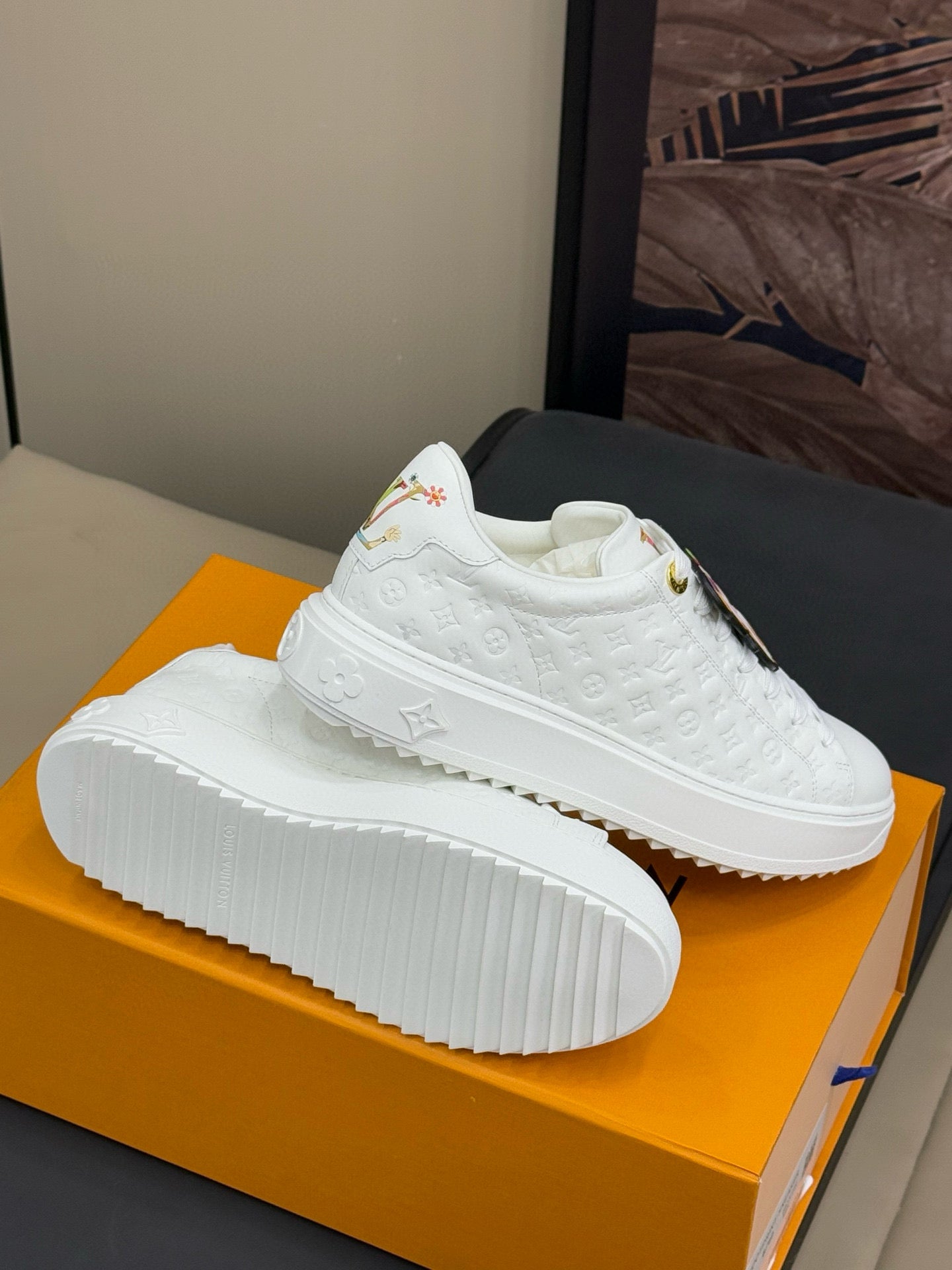 LOUIS VUITTON TIME OUT SNEAKER IN WHITE EMBOSSED MONOGRAM CALFSKIN