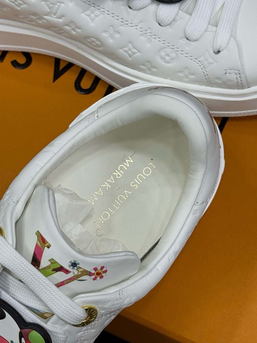 LOUIS VUITTON TIME OUT SNEAKER IN WHITE EMBOSSED MONOGRAM CALFSKIN