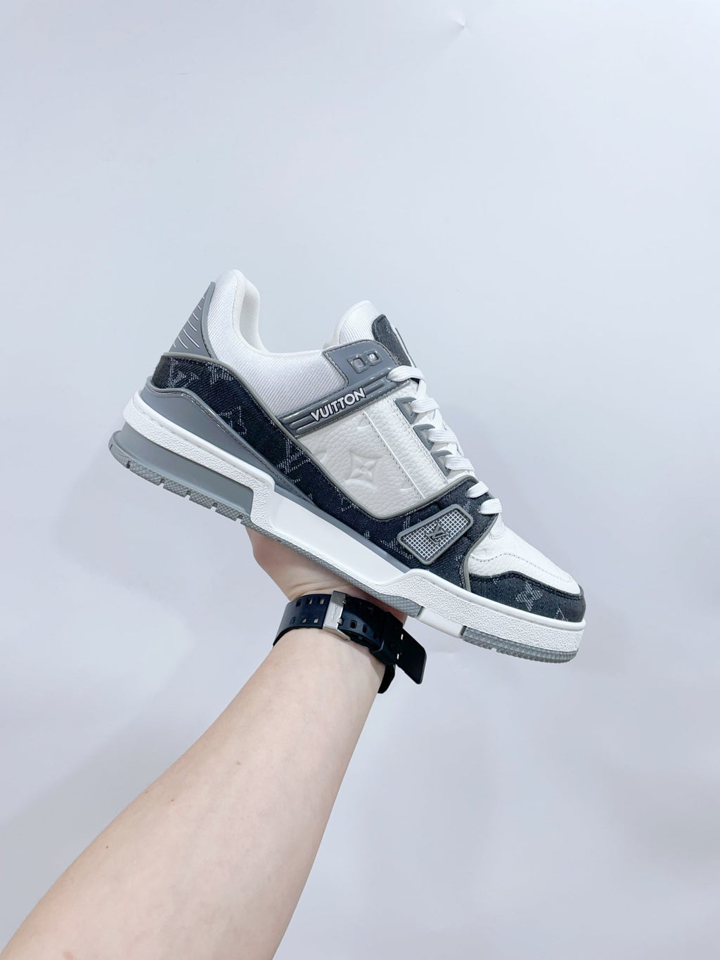 LOUIS VUITTON LV TRAINER SNEAKER IN WHITE CALFSKIN AND BLACK MONOGRAM DENIM