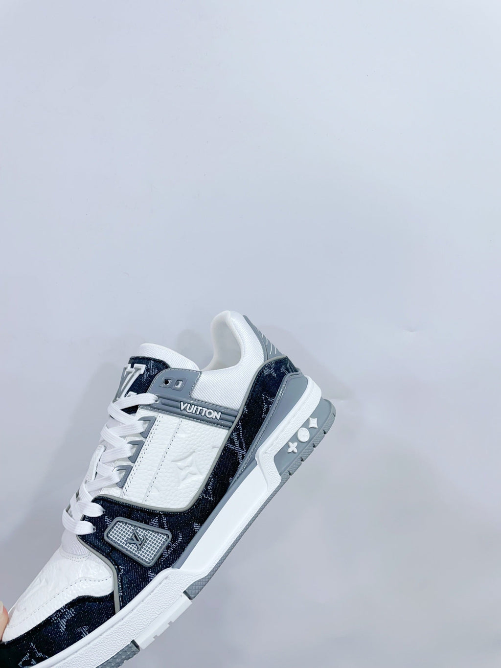 LOUIS VUITTON LV TRAINER SNEAKER IN WHITE CALFSKIN AND BLACK MONOGRAM DENIM