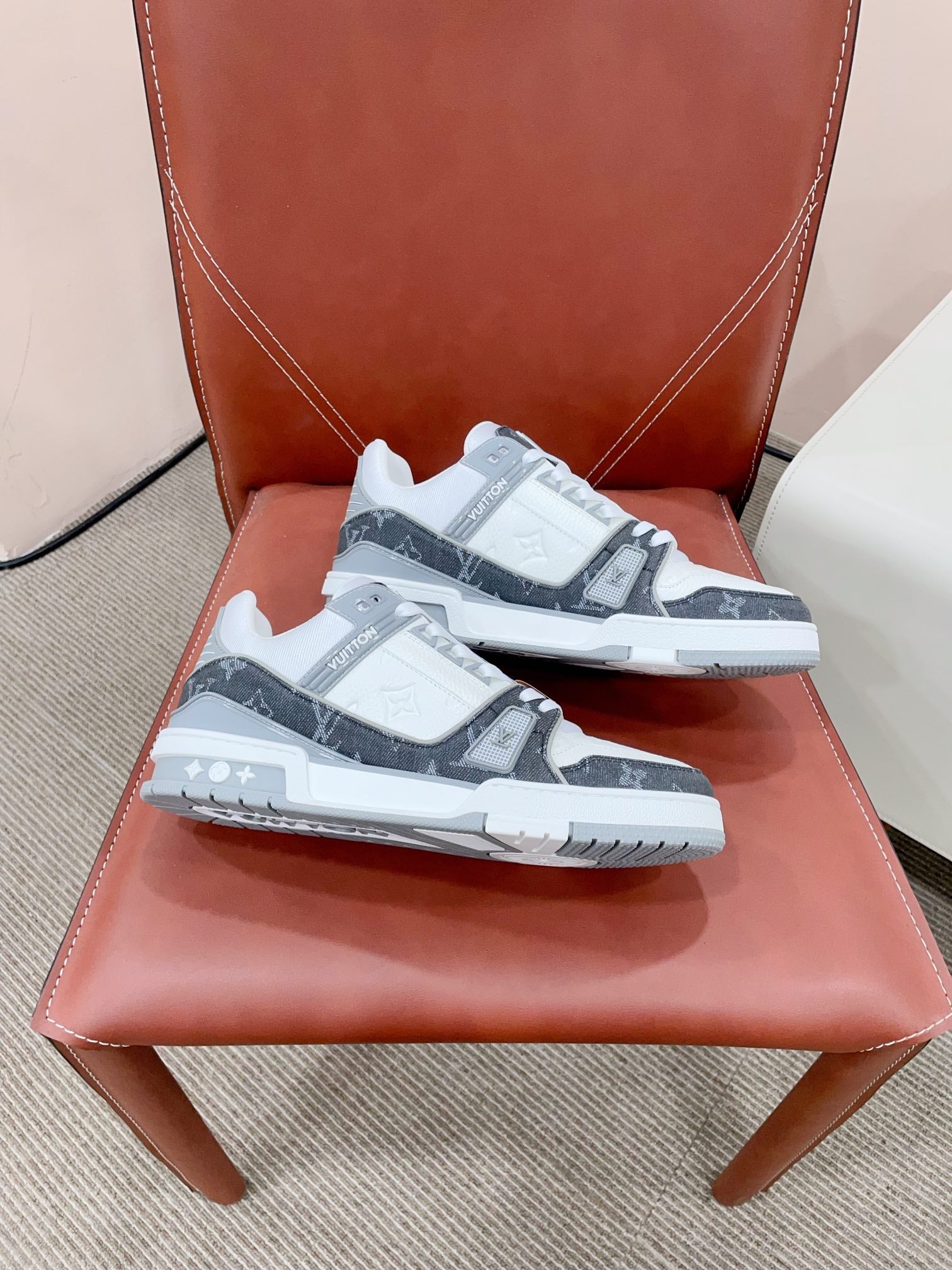 LOUIS VUITTON LV TRAINER SNEAKER IN WHITE CALFSKIN AND BLACK MONOGRAM DENIM