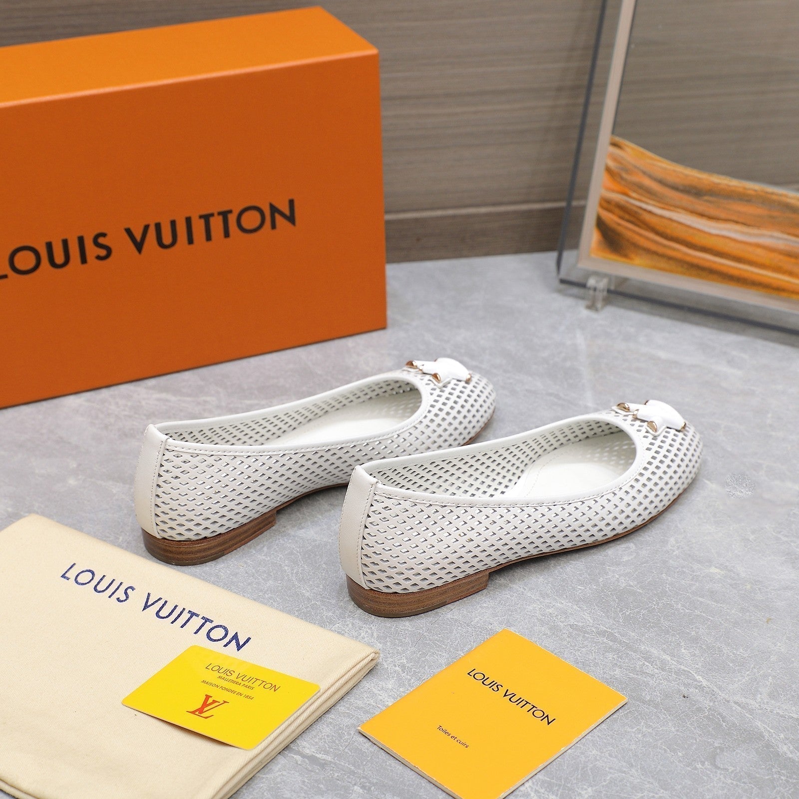 LOUIS VUITTON LV WOMEN'S BALLET FLAT IN WHITE CALFSKIN WITH PERFORATION CRAFTMANSHIP